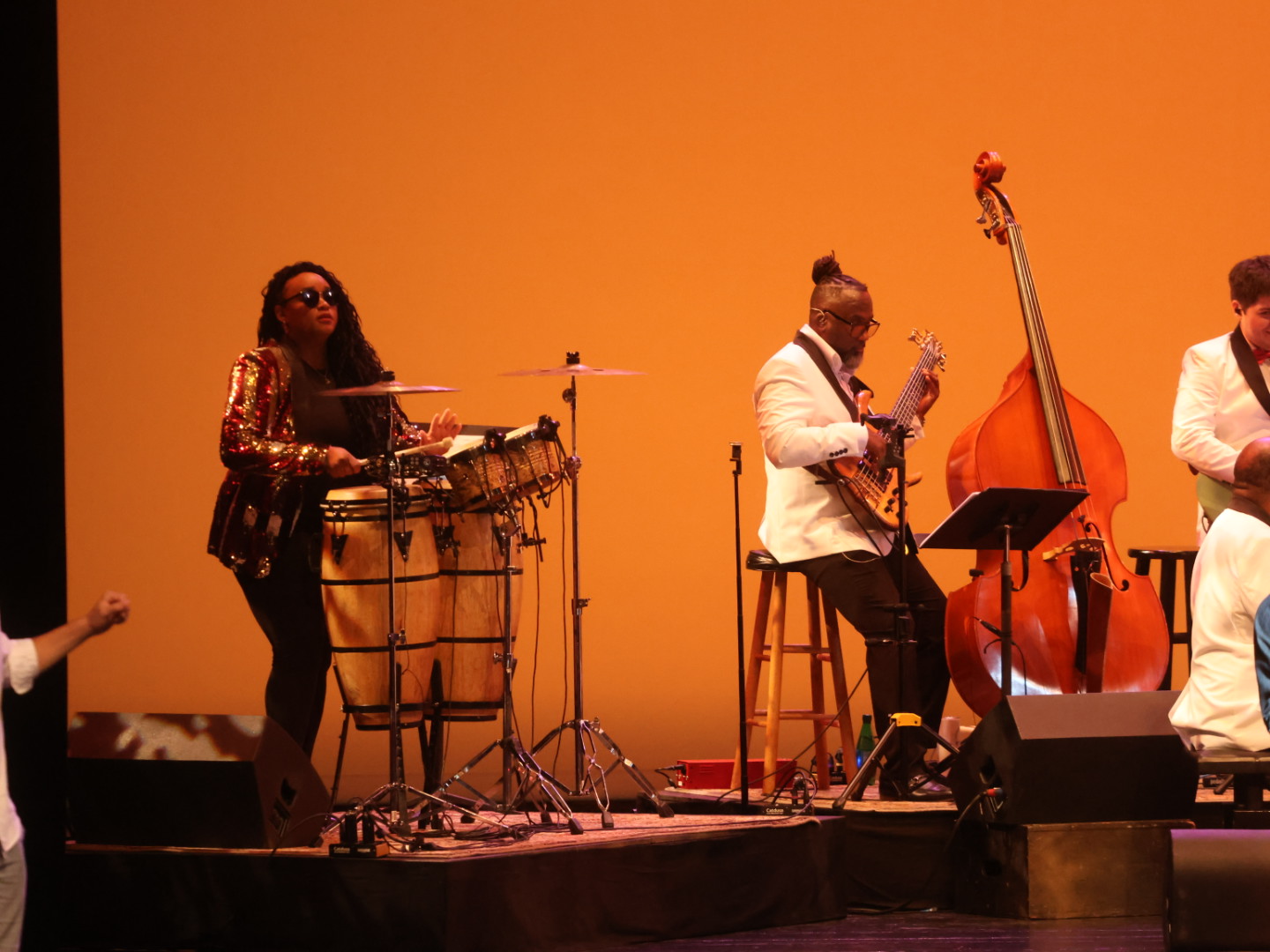 Musicians performing on stage at Broadway on the Hill